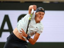 PARIS, FRANCE - JUNE 03: Holger Rune of Denmark serves against Alexander Zverev of Germany in the Men's Singles fourth round match during Day Nine of the 2024 French Open at Roland Garros on June 03, 2024 in Paris, France. (Photo by Clive Mason/Getty Images)